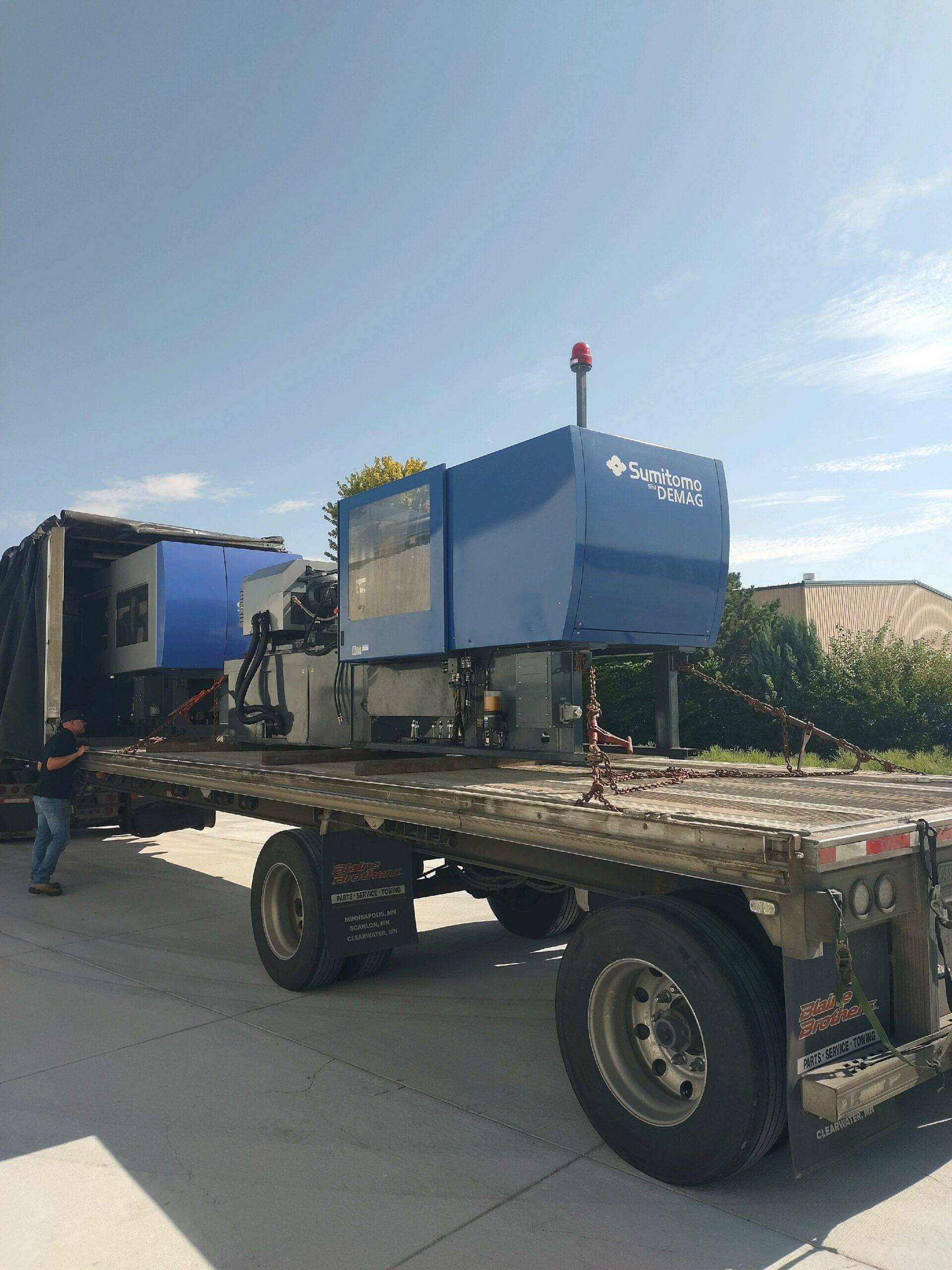 Inspection of the conestoga tarp system for tears or wear on a step deck trailer