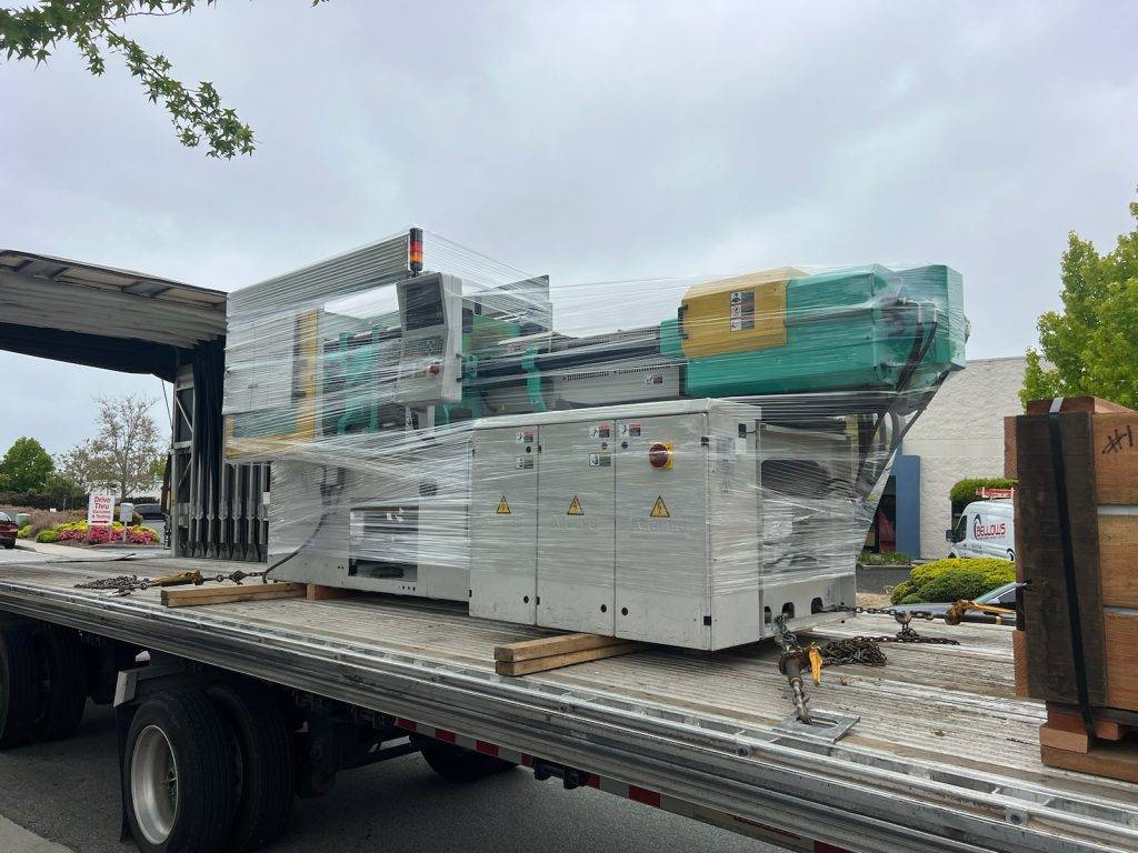 Industrial machinery on a flatbed trailer for cross-border shipment from USA to Mexico