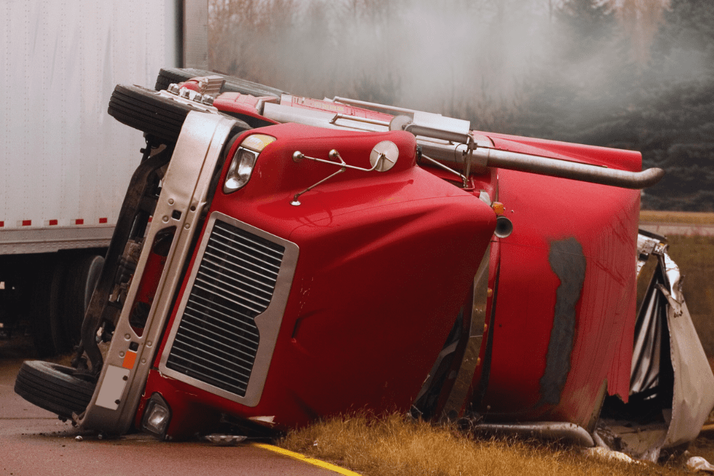 Semi-truck accident with damaged cargo highlighting the need for cargo insurance