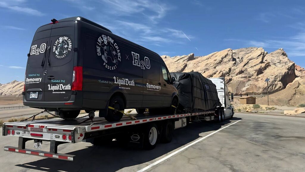 Company Sprinter van secured for freight transport and relocation by Abound Transport.