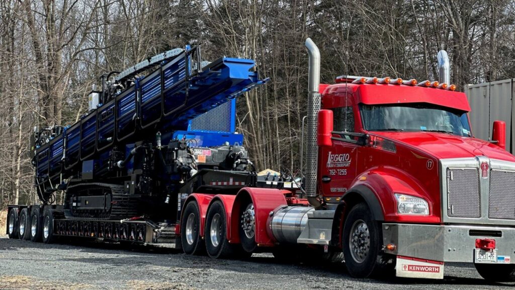 Heavy equipment transport on a lowboy trailer