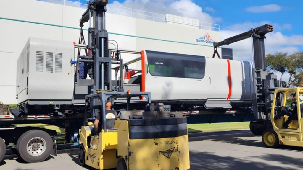 Large industrial machinery loaded and secured for transportation