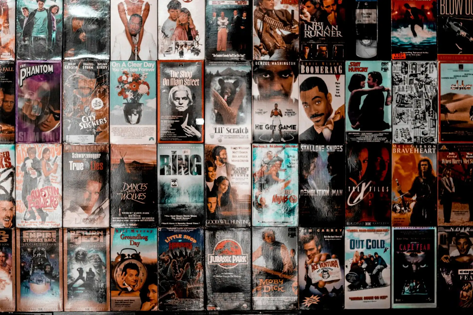 Grid display of classic 1990s retro VHS movie tape covers and cassette boxes