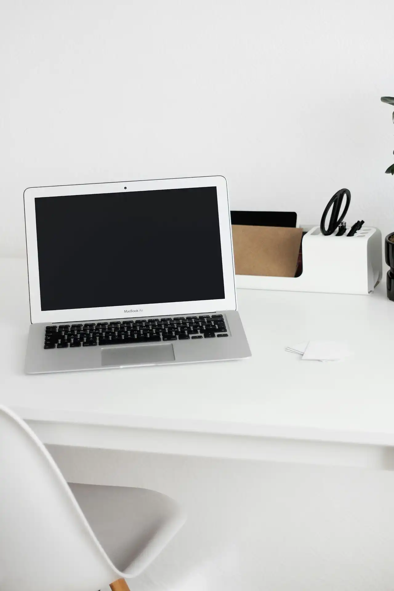 Minimalist office desk setup with laptop for digital freight management, quote coordination, and logistics operations