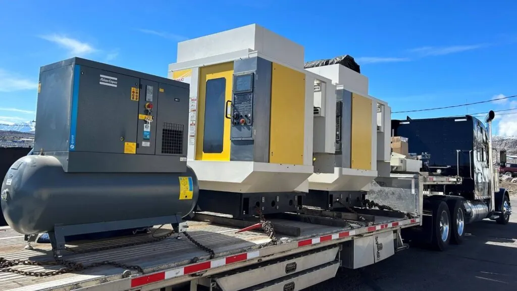 Fanuc CNC Machine loaded on a stepdeck trailer for abound transport loaded machinery example