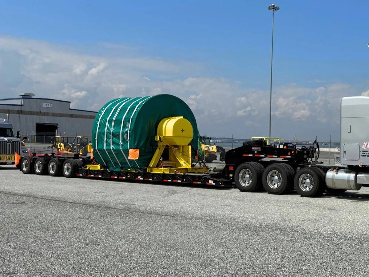 Port machinery loaded on a truck for transport