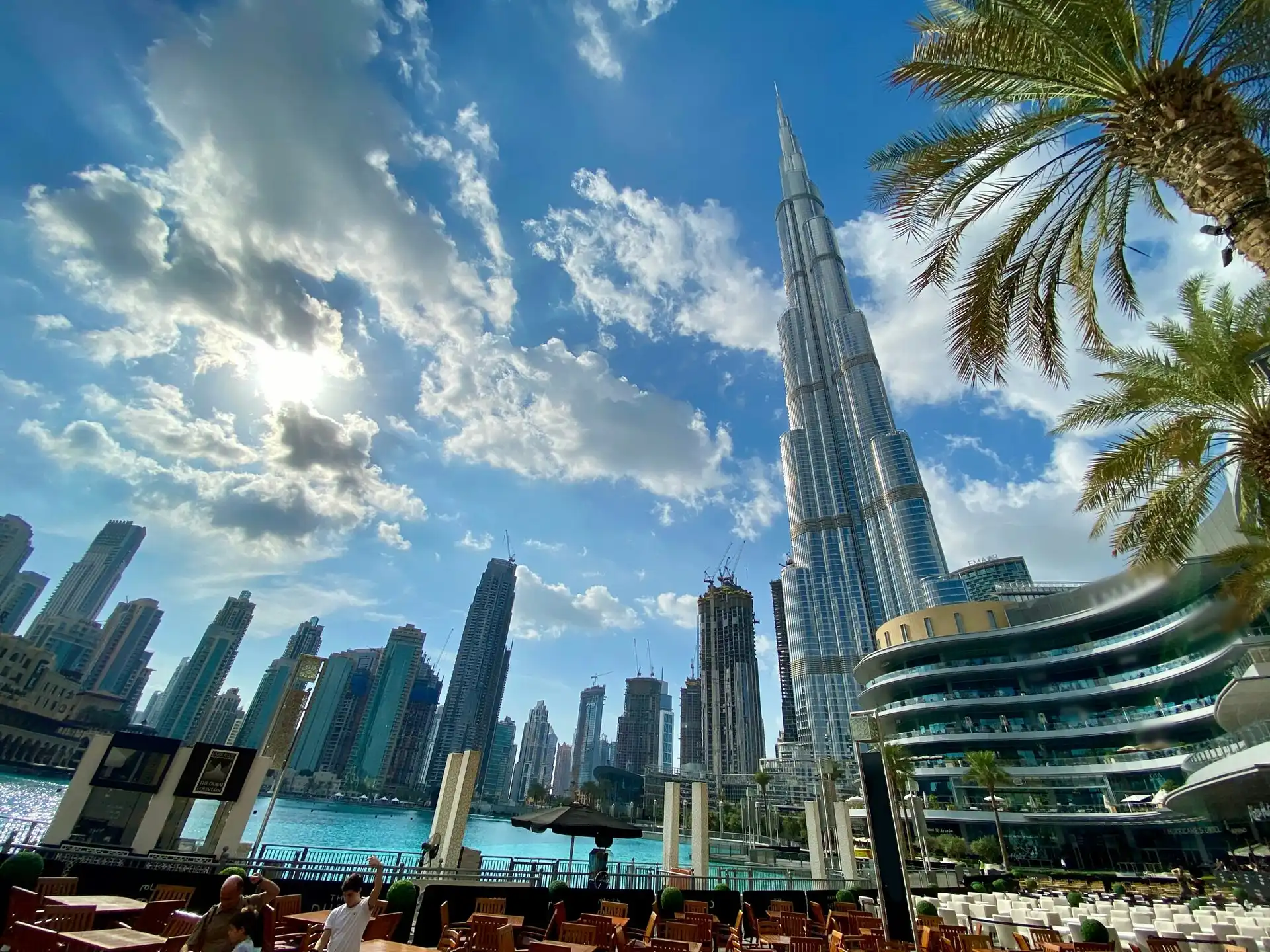 Burj Khalifa skyscraper and Dubai skyline under dynamic clouds representing global commercial logistics and international freight networks