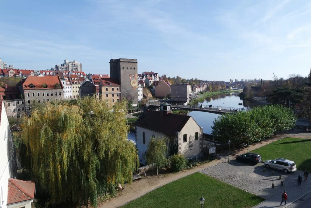 Elevated panoramic view of historic Bautzen old town with the Spree river and traditional red-roofed buildings