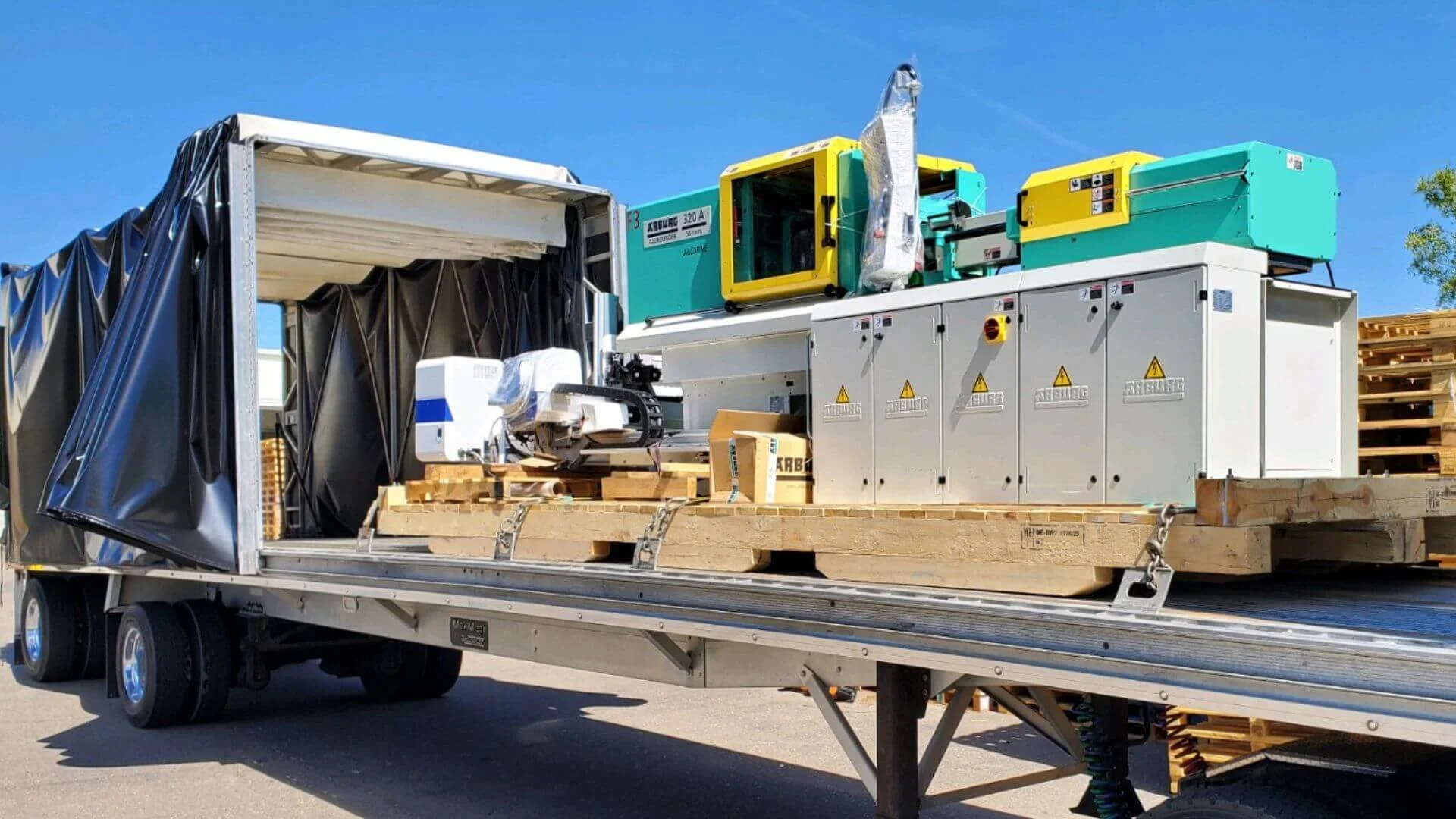 Skidded machine loaded for long-haul transport