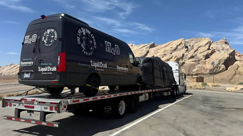 Company Sprinter van secured for freight transport and relocation by Abound Transport.